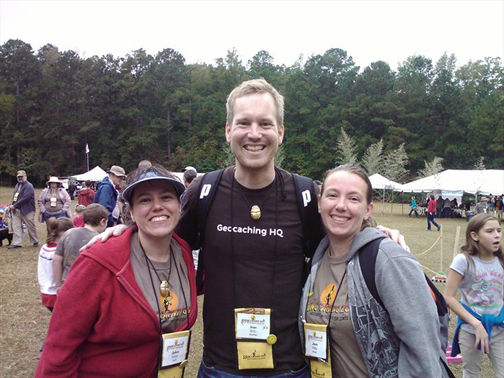 Geocaching HQ'er Sean with a couple of happy geocachers.