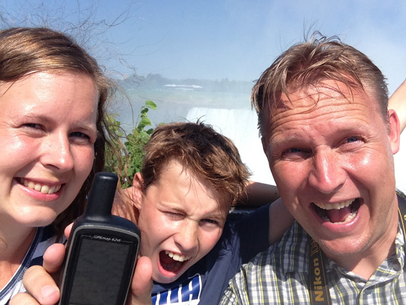 Happy geocachers making the find! Photo by Team OSS