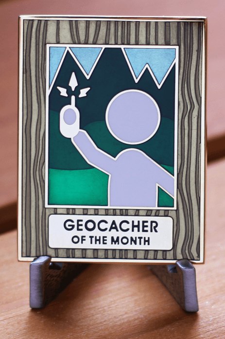 he earned, never for sale, Geocacher of the Month geocoin (sun flare optional)