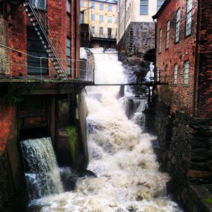 Whitewater running through a brick city.