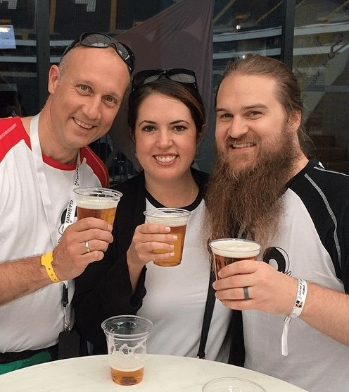 Nicolas, Laporca, takes a break from checking in on exhibitors and vendors to have a beer with Hailee and Justin.