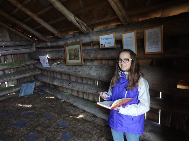 Signing the logbook while still inside the geocache. Photo by geocacher moses_was_here
