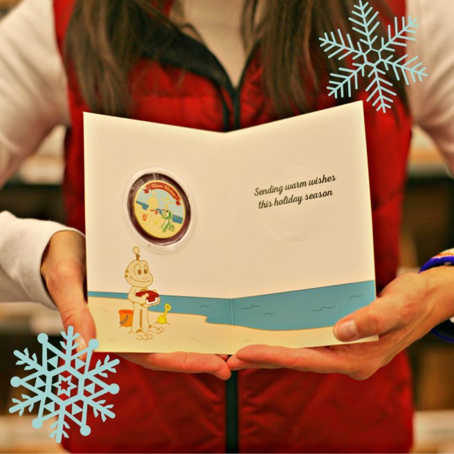 Holiday greeting card with geocoin