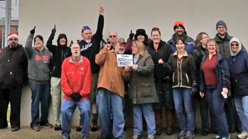 Geocaching group celebrates obtaining the cache