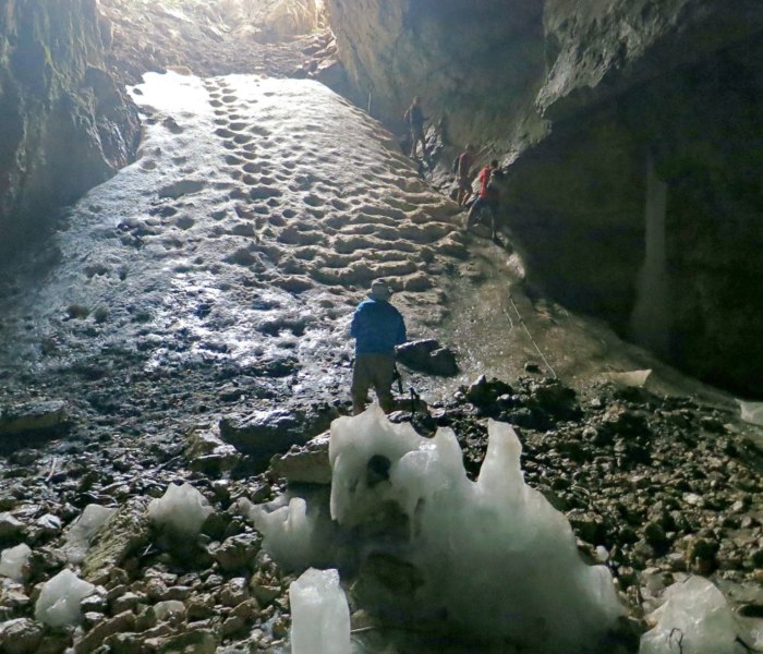 A cable bolted to the wall for hikers to cling to